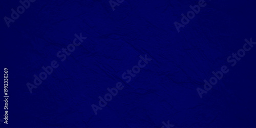 Navy blue stone texture background with subtle marble veins and dark slate rock surface for elegant moody design