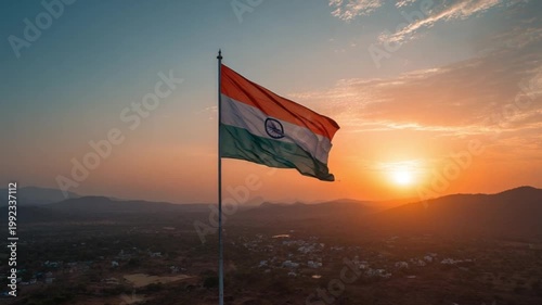 Tricolor flag waving proudly over a hilly landscape bathed in the warm glow of sunset