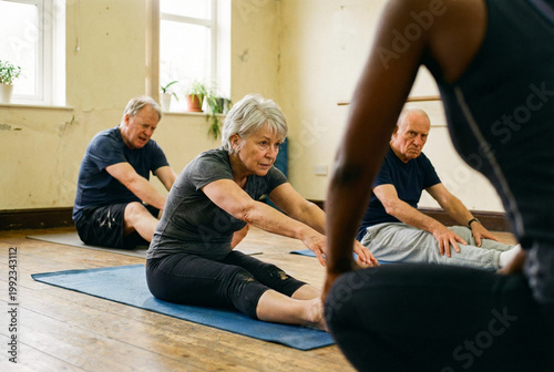 Active seniors performing stretching exercises on yoga mats during a group fitness class for elderly