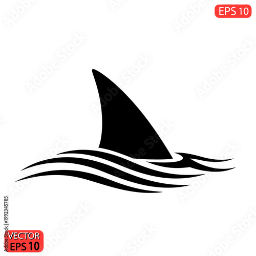 Shark fin in the ocean waves.