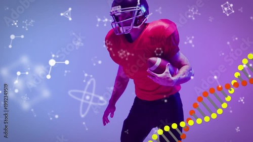 Camera panning up, sports player shifting feet, securing ball, starting run for gain with DNA helix