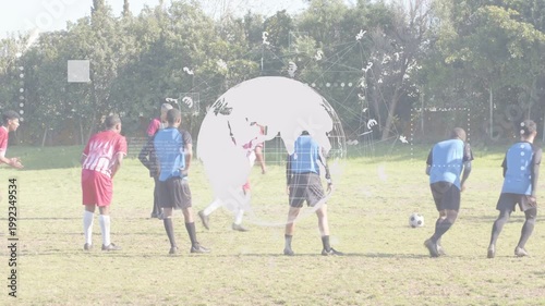Soccer red kicker running up and kicking ball globe overlay masking pitch red team celebrating goal