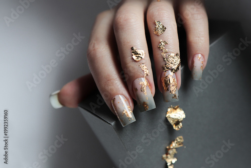 hands with golden manicure.