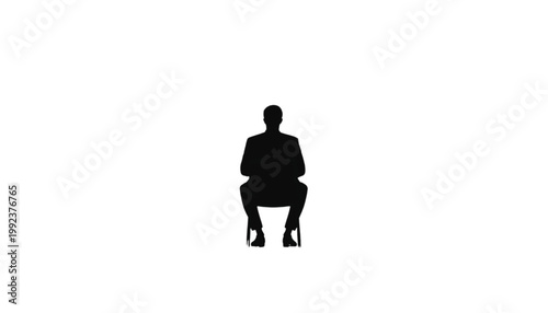 Businessman sits on a chair in a professional pose to represent a stable and calm corporate environment now.