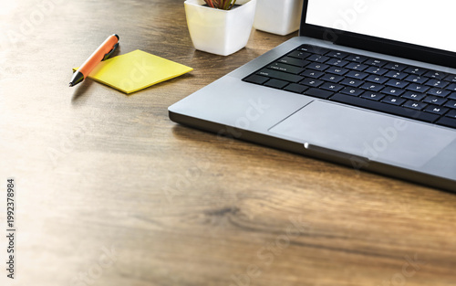 yellow sticky note wooden desk with laptop