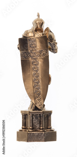 Golden figurine of a medieval knight isolated on white background