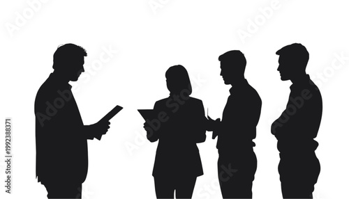 Businesspeople stand together in a group to discuss important corporate strategies and project plans.