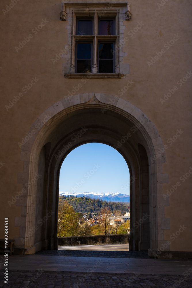 Fototapeta premium View of the still snow-capped Pyrenees in spring from the gateway of the Château de Pau overlooking the Boulevard des Pyrénées