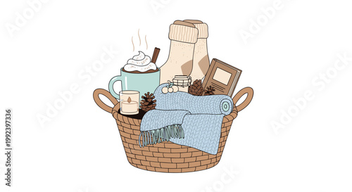 A rustic wicker gift basket contains a mug of hot cocoa, a blue knitted blanket, pinecones, a candle, and a small book for a cozy winter atmosphere.