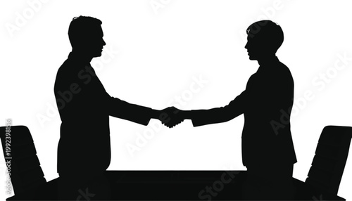 Business partners shake hands over a meeting table to finalize a successful corporate agreement deal.