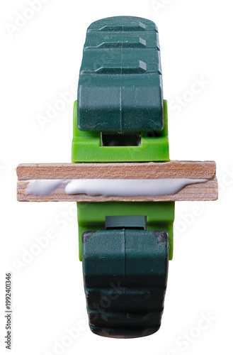 Obraz na plátně A carpenter's clamp with two pieces of wood clamped and glued together