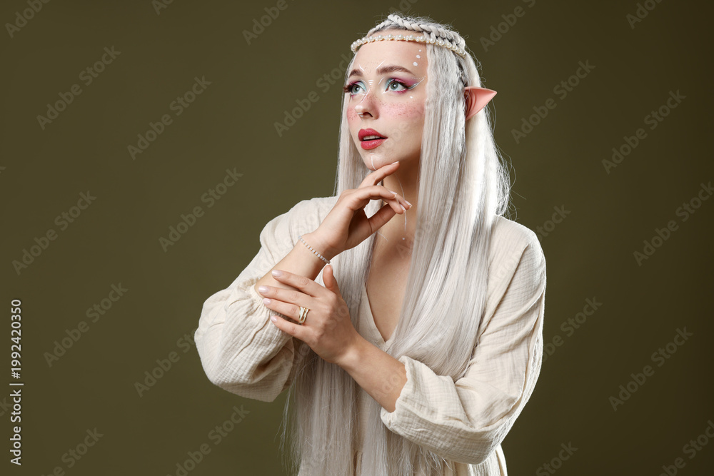 Naklejka premium Beautiful elf girl on dark olive background
