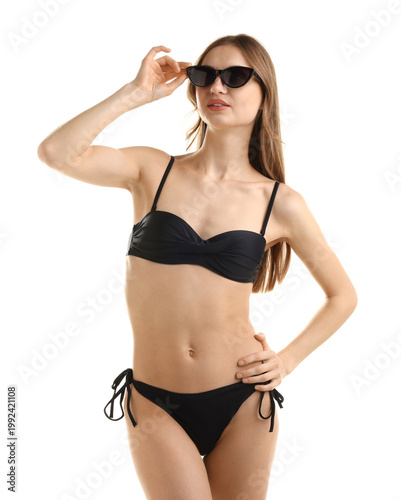 Foto Beautiful woman wearing stylish swimsuit and sunglasses on white background