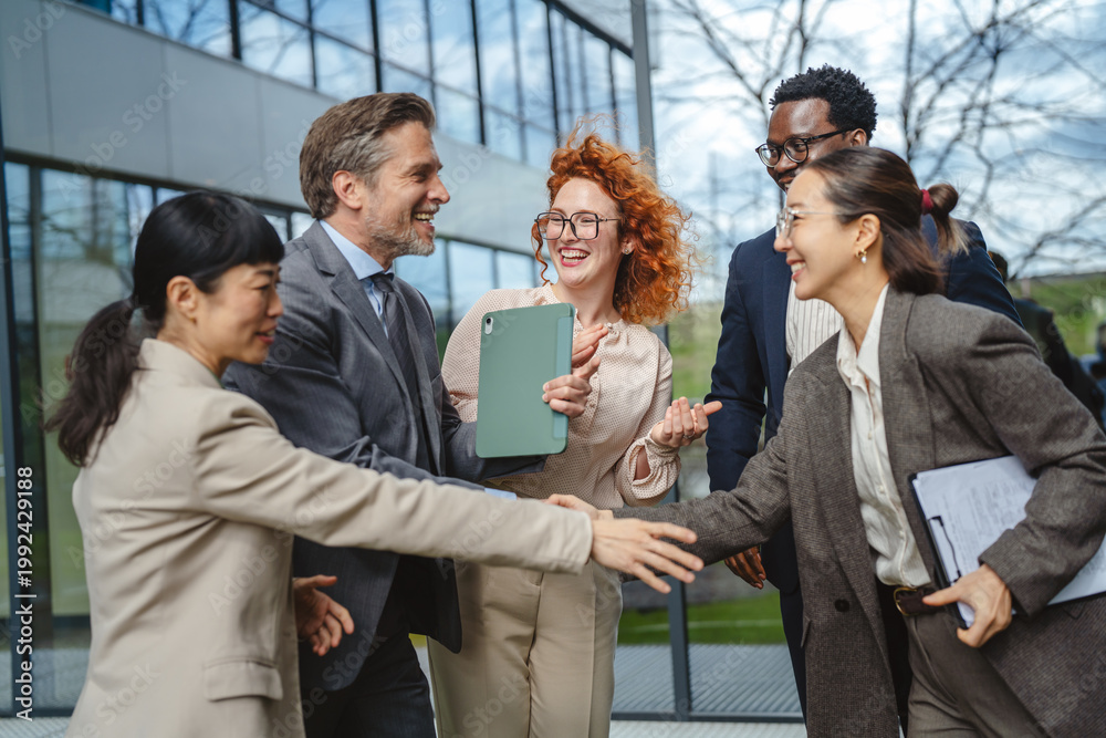 Obraz premium Diverse business people shaking hands enjoying outdoor meeting