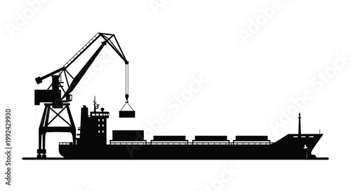 Black silhouette of a cargo ship being loaded by a dockside crane