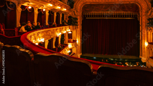Konstfotografi Elegant theatre interior with plush red velvet seats and ornate golden balconies