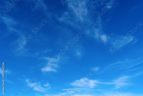 Photos Blue sky wispy white clouds minimal serene horizon background horizontal composi