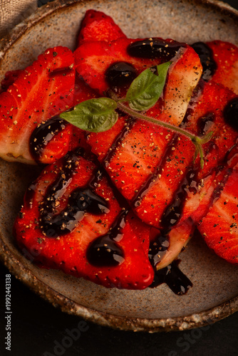 Tableau sur toile Savory Strawberries with Balsamic Cream and Black Pepper on Handmade Ceramic Pla