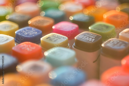 Canvastavla High-angle shot of a vibrant set of professional multi-colored markers arranged on a white workspace, symbolizing creativity, artistic hobby, and design inspiration