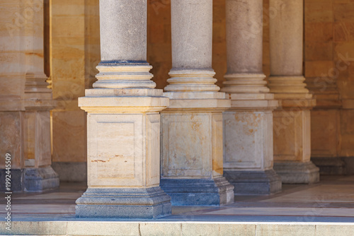 Architectural stone columns in historic building hallway