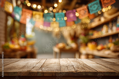 Brazilian Festa Junina decoration featuring a rustic wooden table as the focal point against a blurred kitchen background. A cozy, festive atmosphere with space for text.