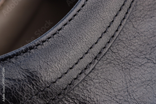 close-up details of genuine leather and suede shoes, lacing and seams