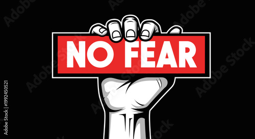 Hand holding "NO FEAR" sign, concept of courage, bravery, and overcoming obstacles