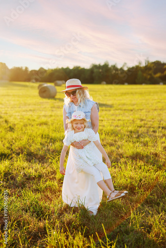 Warm family moment in nature, full of love and carefree joy.