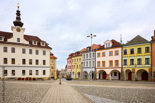 Historic european town square with colorful buildings and clock tower