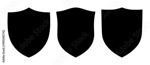 Shield set with black silhouette on white background featuring emblems, protective armor, heraldry with symbols of strength and authority.