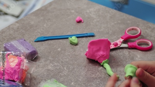 Little girls sculpt figurines crafts from air plasticine, modeling dough. Online lessons in tablet. Children's creativity hobby developing activities, training, learn of fine motor skills of hands.