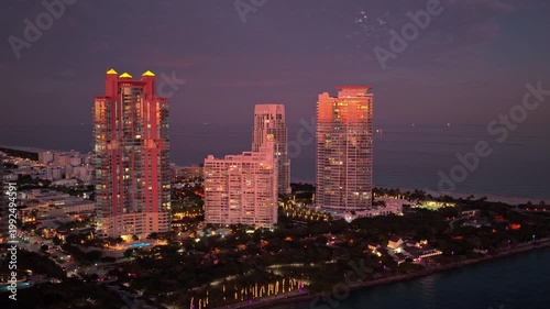 Miami, Florida architecture skyscraper. City night illuminated building. Skyscraper cityscape. Night city of Miami. Luxury city life. Night aerial view. Night cityscape of Miami skyscraper building