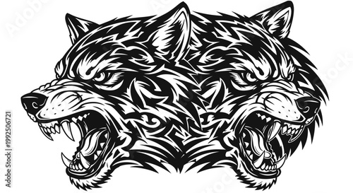 Two aggressive wolf heads with tribal tattoo design.