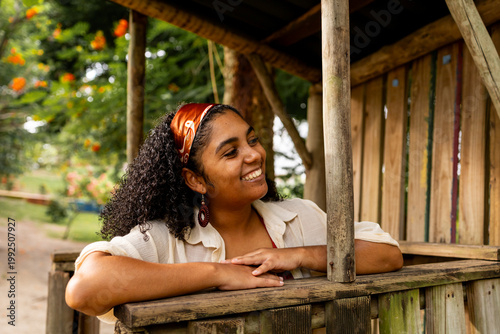 Young Woman Resting on a Wooden Garden Gazebo