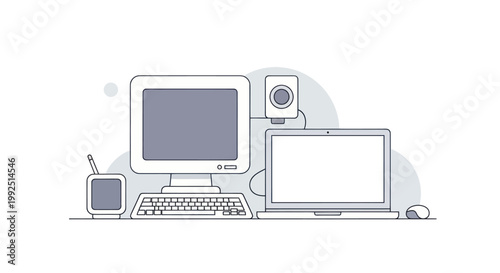 Vintage and Modern Computer Setup with Peripherals.