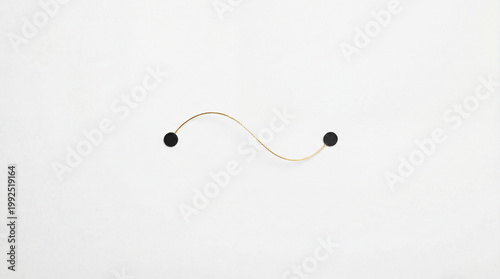 Minimal white composition with black points and a delicate gold thread creating visual balance