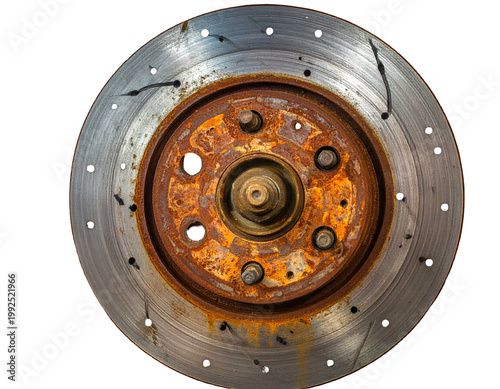 Close-up, overhead view of a rusty, perforated vehicle brake rotor