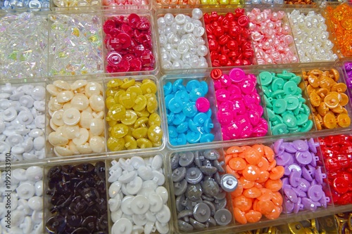 Coloured buttons in trays