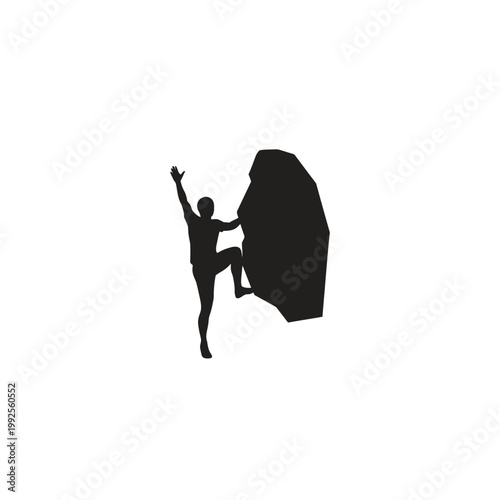 Silhouette of a man rock climbing a large boulder, reaching for the summit.