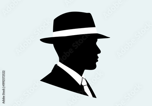 Silhouette of a man in a fedora hat