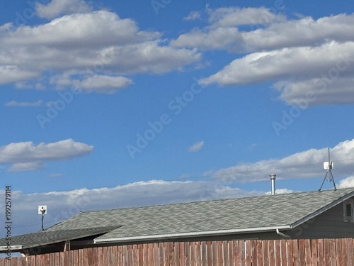 фотографія view of asphalt shingles on roof showing maintenance and durability concept