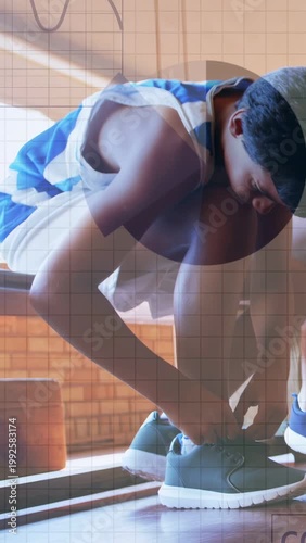 Vertical video: Boy seeing loose laces tying shoe on bench for sports with charts marking laces