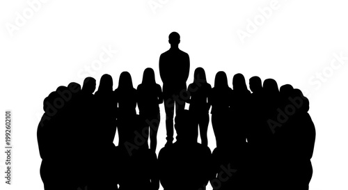 Silhouette of a group of people standing together.