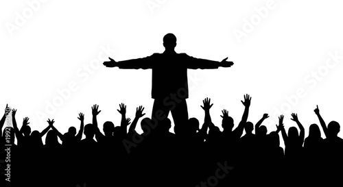 Silhouette of a man standing on a crowd with arms outstretched in celebration.