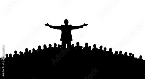 Silhouette of a man standing on a hill with arms outstretched before a crowd.
