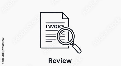 A magnifying glass examines an invoice document closely on a desk