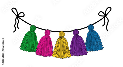 Colorful hanging tassels strung on a decorative garland with tied bows celebrating festive occasions and joyful