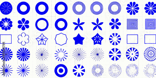 Arrangement of blue geometric shapes and floral like patterns on white