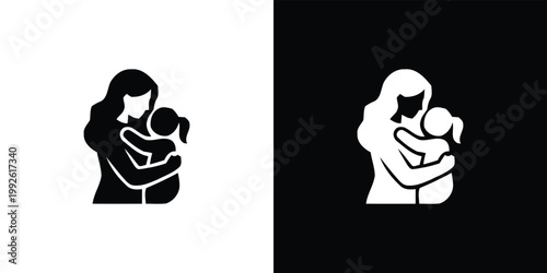 Black and white silhouettes of woman holding baby on white and black background mother