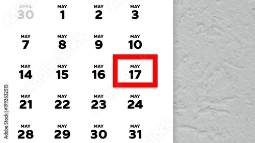 The date May 17th marked with a red cursor on the wall calendar 2026